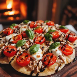 The main ingredients for summer tomato and chicken flatbreads are simple and fresh. You need four flatbreads, like pita or naan. You also need two cups of cooked chicken breast, shredded. For the toppings, grab two cups of halved cherry tomatoes and one cup of fresh mozzarella cheese, torn into small pieces. You will use a quarter cup of basil pesto and a quarter cup of balsamic glaze for extra flavor. Add half a teaspoon of garlic powder and some salt and pepper to taste. Fresh basil leaves work great for garnish, and don’t forget olive oil for brushing.